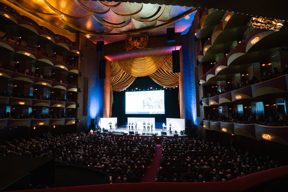 a photo of the metropolitan opera house during the Baron Investment Conference